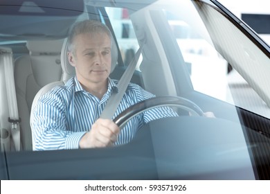 Confident On The Road. Mature Man Sitting In His Newly Bought Car With His Hands On The Steering Wheel Copyspace Insurance Safety Driving Successful Wealthy Lifestyle Consumerism Purchase Buy Concept