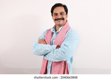 A Confident Portrait Of A Happy Indian Farmer In Rural India Concept. Standing In The White Background, The Passionate Farmer Full Of Enthusiasm Is Happy And Ready To Achieve.