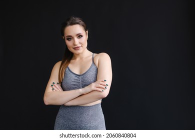 Confident Pose Of Fitness Trainer Portrait. Woman In Sportswear. Strong Beautiful Sportswoman With Make-up. The Owner Of Gym. Lifestyle. Sportive Curvy Girl With A Muscular Figure. Healthy Aerobics