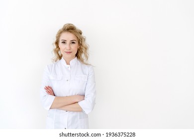 Confident and professional woman doctor in white uniform with medical stethoscope stand on copy space background, crossed hands on chest. Concept of business portrait for clinic or hospital website