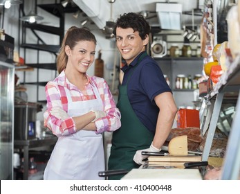 Confident Salespeople At Counter In Cheese Shop - Powered by Shutterstock