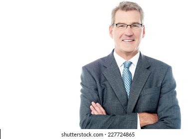 Confident Senior Business Executive With Folded Arms 