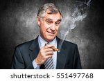 Confident senior businessman smoking a cigar