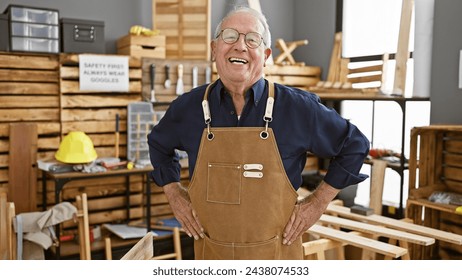 Confident senior man carpenter smiling and standing strong at his carpentry workshop, living a fulfilling life of woodworking and furniture-making. - Powered by Shutterstock