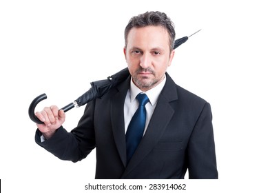 Confident And Serios Business Man Holding Closed Umbrella On His Shoulder