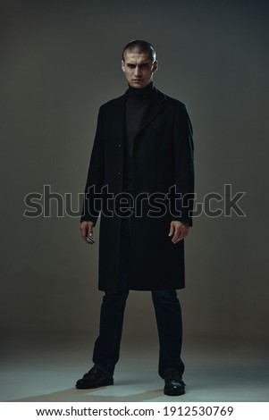 Similar – Image, Stock Photo Man in a coat standing on a sandy beach looking at a dog in the distance, with dunes and a blue sky overhead in Lariño, Galicia