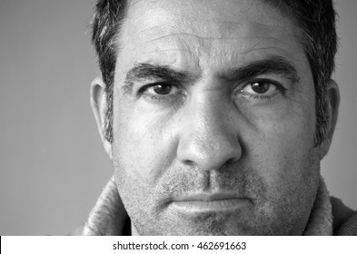 Confident serious middle age man (male age 40-45) looking at the camera. Man middle age concept. Real people. Copy space