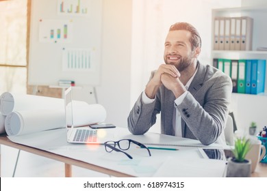 Confident smiling architect in formal wear dreaming and  working with blueprint papers and drawings in modern lightful office - Powered by Shutterstock