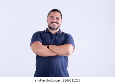 A confident smiling man of mixed race with arms crossed. Barrel chested guy in his Late thirties. Isolated against a white background. - Shutterstock ID 2146311205
