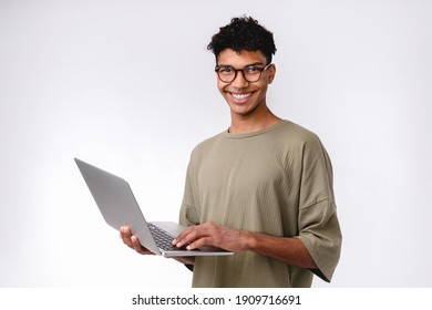 Confident Smiling Young African Male Student Using Laptop Isolated Over White Background