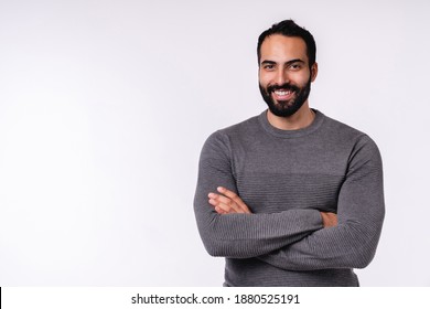 Confident smiling young arabian man in casual clothes isolated over white background