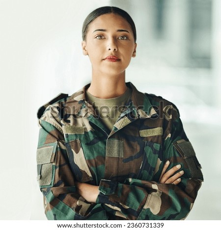 Confident soldier portrait, woman and arms crossed in army building, pride and professional hero service. Military career, security and courage, proud girl in camouflage uniform at government agency.