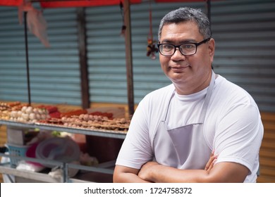 Confident Street Hawker Man Working With His Delicious Meatball Skewer Street Food; Concept Of Asian Street Food, Tourism With Local Food, Small Business, Street Food Hawker