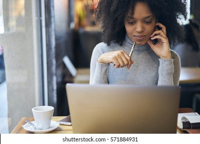 Confident Successful Female Administrative Manager Of Trading Corporation Making Online Parley With Business Partners Discussing Details Of Collaboration Using Laptop Computer And Free Wifi Connection