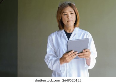 Confident transgender STEM profession non-binary person in lab coat and protective glasses - Powered by Shutterstock - Get 15% off with code: PIKWIZARD15