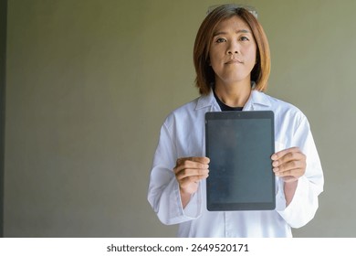 Confident transgender STEM profession non-binary person in lab coat and protective glasses - Powered by Shutterstock - Get 15% off with code: PIKWIZARD15