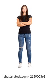 Confident unhappy woman with crossed or folded arms.  Full body length isolated over white.