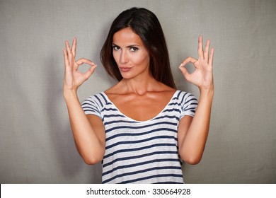 Confident Woman In Blue Blouse Congratulating With Ok Sign