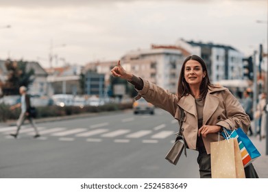 Confident woman hails taxi in city, juggling shopping bags. Independent and stylish, she embodies modern urban lifestyle. Busy street captures energy of urban exploration and retail therapy - Powered by Shutterstock