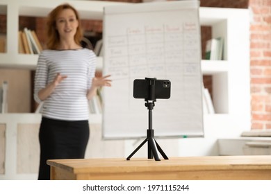 Confident Woman Mentor Recording Presentation, Webinar On Smartphone Standing On Tripod, Teacher Coach Explaining, Holding Online Lesson, Using Phone Webcam, E-learning And Distance Education