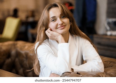 Confident Woman Smiling in Cozy Cafe Setting. - Powered by Shutterstock