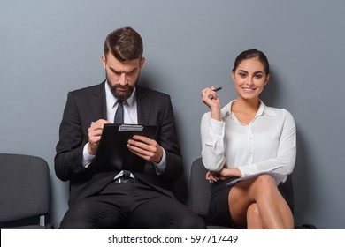 Confident Woman With A Smug Face. Satisfaction Of Having An Advantages Is What This Woman Feeling. Stressed Unemployed Man Checks His Resume.