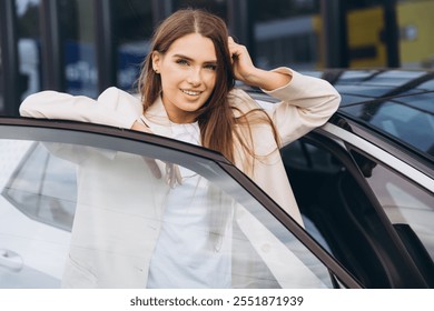 A confident woman in a stylish outfit smiles while standing by her car. The image captures elegance, confidence, and a modern lifestyle. Ideal for concepts of empowerment and successful living. - Powered by Shutterstock