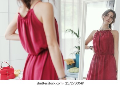 Confident Woman Trying A New Outfit And Getting Ready To Go Out, She Is Looking At Herself In A Mirror