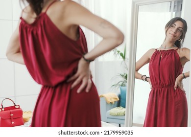 Confident Woman Trying A New Outfit And Getting Ready To Go Out, She Is Looking At Herself In A Mirror