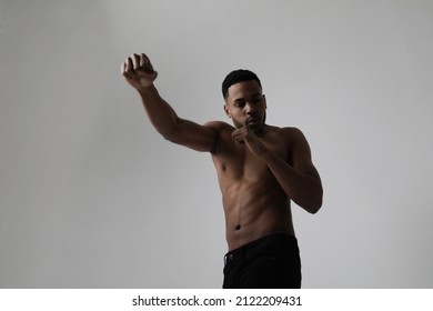 Confident Young Black Male Boxer Practicing Boxing Isolated In Studio.