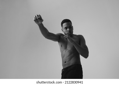 Confident Young Black Man Boxer Practicing Boxing Isolated In Studio.