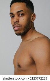 Confident Young Black Man With Perfect Body Isolated In Studio. Vertical.