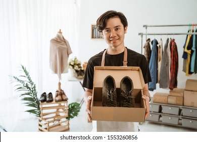 Confident Young Businessman Working At Online Business Store. Small Business Owner At His Workshop