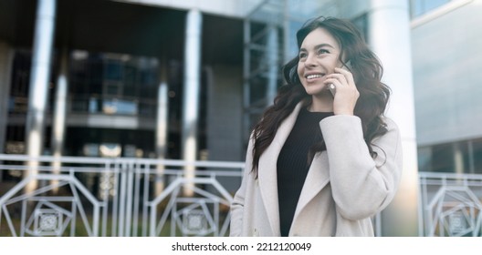 Confident Young Businesswoman Talking On Mobile Phone With A Big Smile On Her Face Outside The Office, Strong And Independent Woman Concept