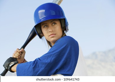 Confident Young Caucasian Woman With A Softball Bat