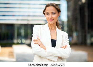 Confident young female manager outdoor in a modern urban setting - Shutterstock ID 2226152631