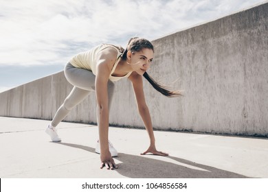 Confident Young Girl Running Around In The Open Air, Doing Sports And Getting Ready For A Marathon