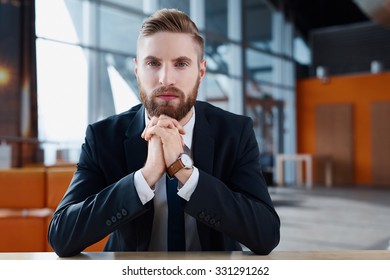 Confident Young Hipster Businessman At Modern Office