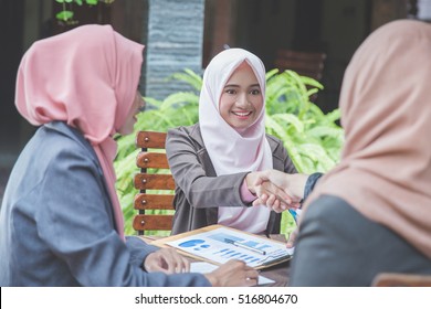 Confident Young Muslim Business Woman Shaking Hands. Teamwork Deal Concept