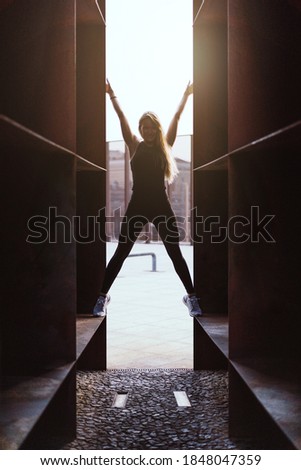 Similar – Image, Stock Photo Happy woman jumping in front of stone wall background