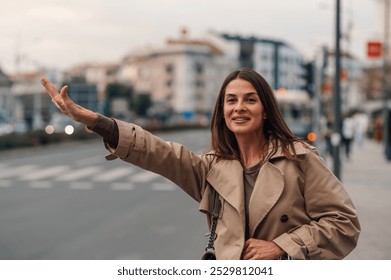 Confident young woman hailing taxi in busy city street, ready for work. Urban lifestyle captured in bustling cityscape - Powered by Shutterstock