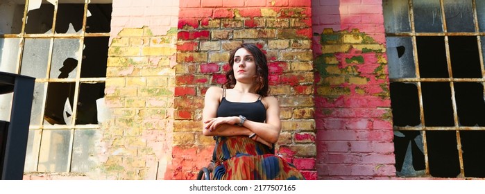 Confident Young Woman Sitting In Her Wheelchair. Strong Woman Concept.