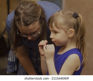 A Confidential Conversation Between Sisters, The Elder Takes Care Of The Younger Sister. They Feel Good Together