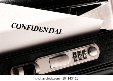 Confidential Document Letter Sticking Out Of A Little Ajar Open Briefcase During A Top Secret Classified Information Exchange And Review Meeting