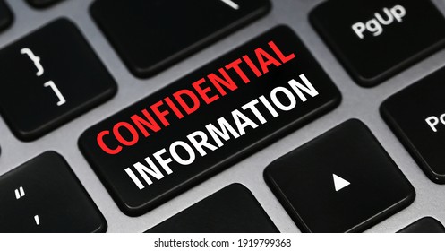 Confidential Information Text On A Keyboard. Technology And Business Concept.