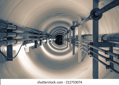 Confined Space Inside Underground Tunnel. Construction From Engineering Technology For Infrastructure I.e. Power Line Or Cable, Steel Pipe In Perspective View. To Transport Water, Gas And Electricity.