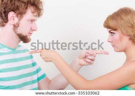 Conflict bad relationships concept. Two people couple pointing fingers at each other