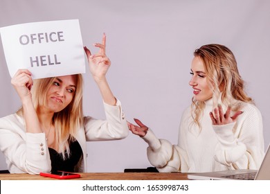 Conflict Between Two Female Manager Colleagues. Young Employee Holding Sign Office Hell. 