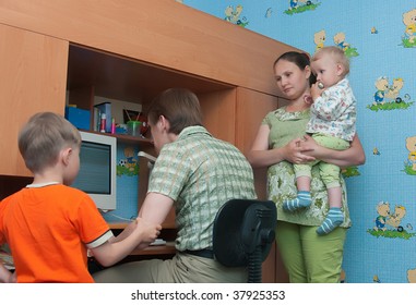 The Conflict In A Family: The Husband Plays The Computer And Does Not Pay Attention To A Family