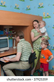 The Conflict In A Family: The Husband Plays The Computer And Does Not Pay Attention To A Family